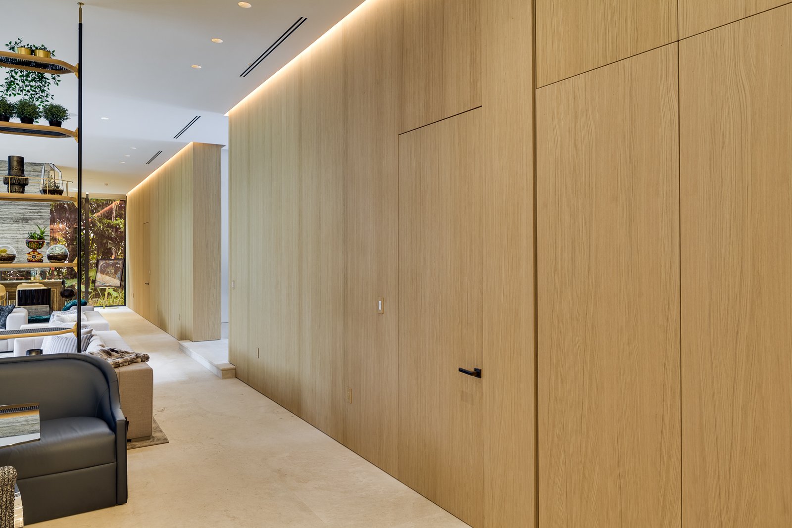 Bespoke doors and elegant, seamless wood paneling made in Italy
